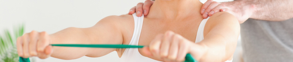 Physical Therapist guiding a patient through an exercise